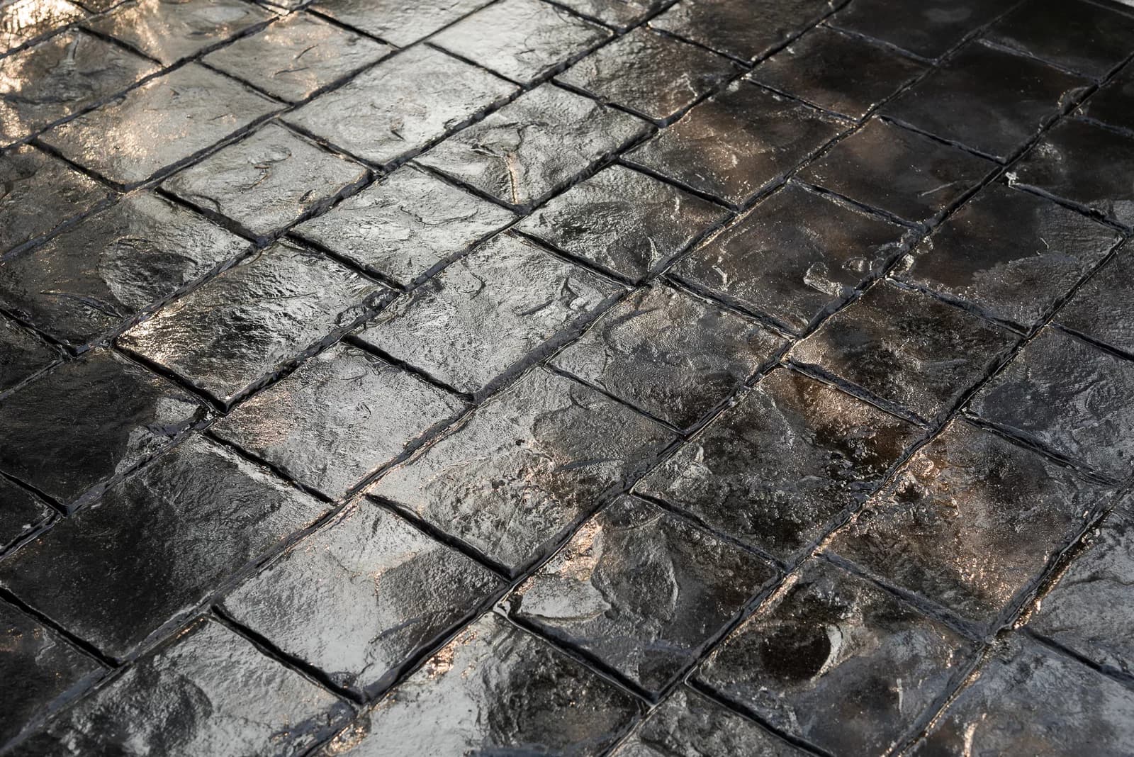 Can you do stamped concrete over existing concrete?