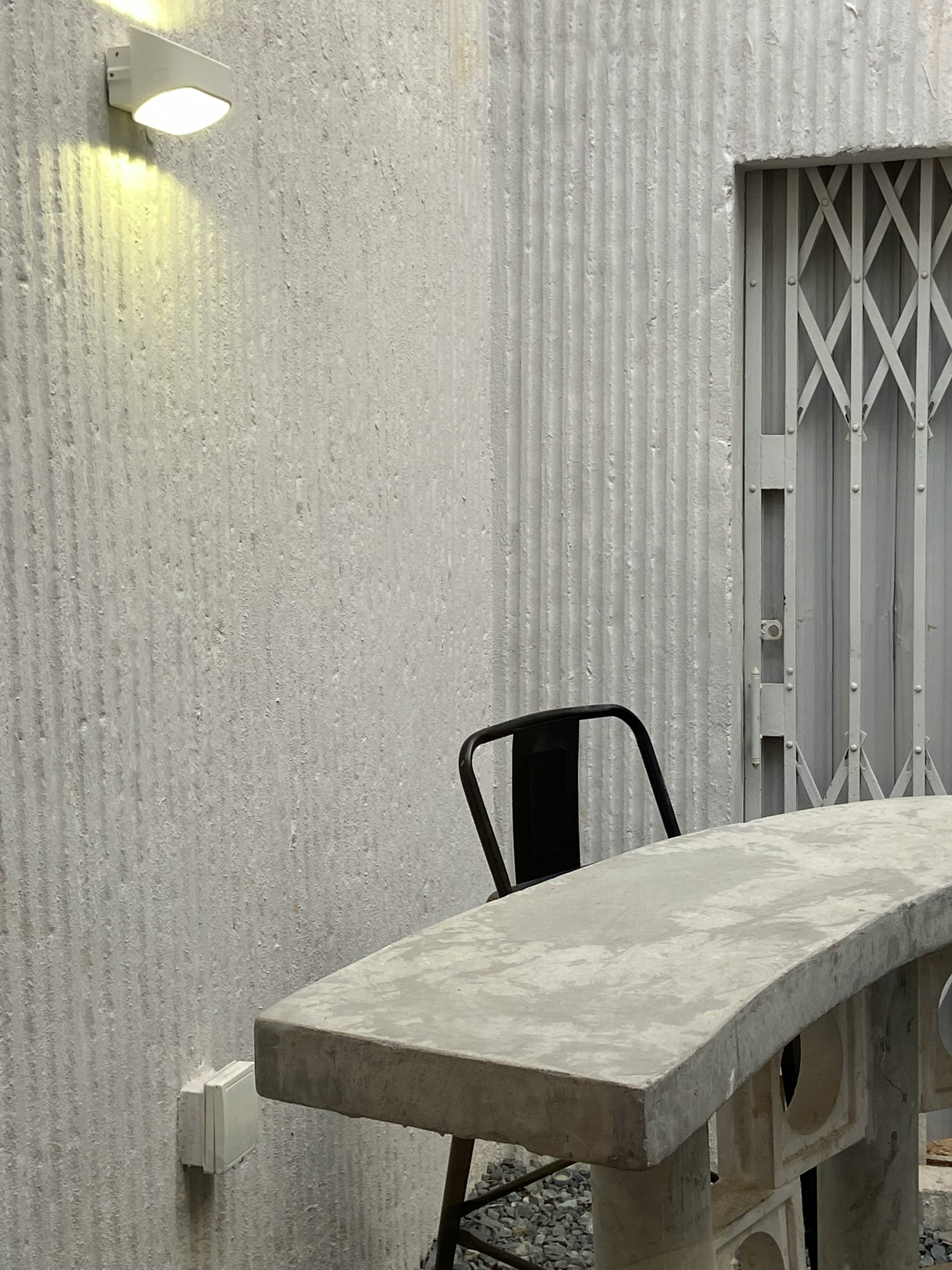 Concrete patio addition with outdoor furniture